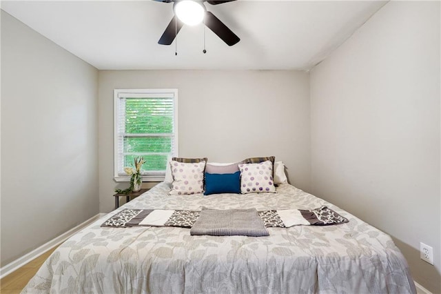 bedroom featuring light hardwood / wood-style flooring and ceiling fan