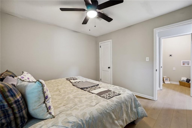 bedroom featuring light hardwood / wood-style floors and ceiling fan