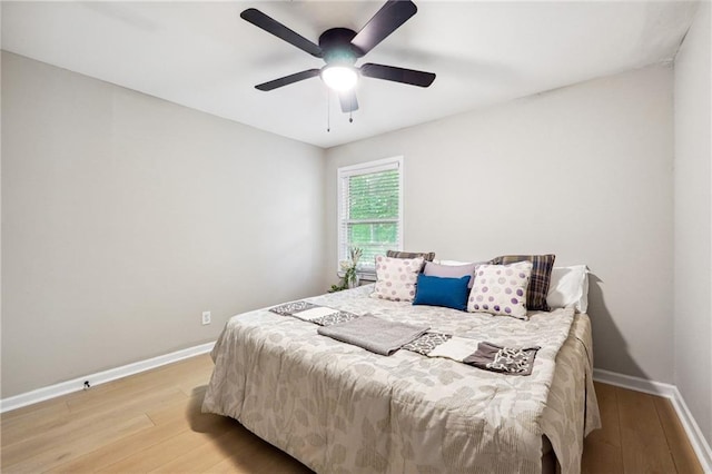 bedroom featuring ceiling fan and light hardwood / wood-style flooring