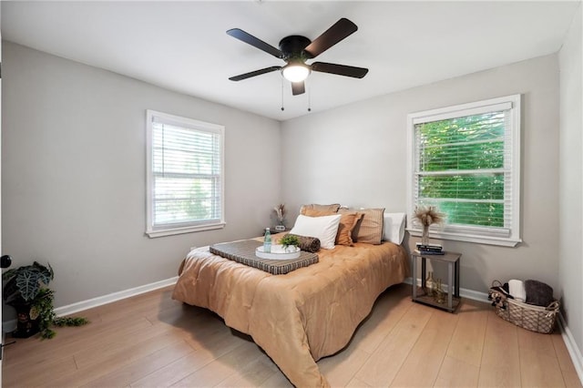 bedroom featuring ceiling fan and light hardwood / wood-style floors