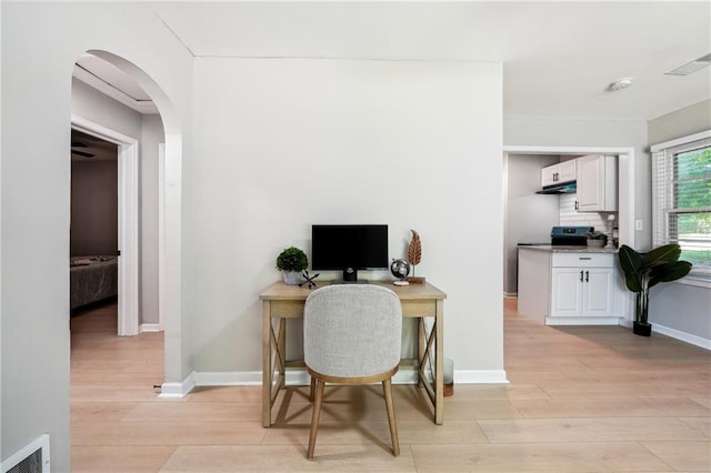 office area with light wood-type flooring