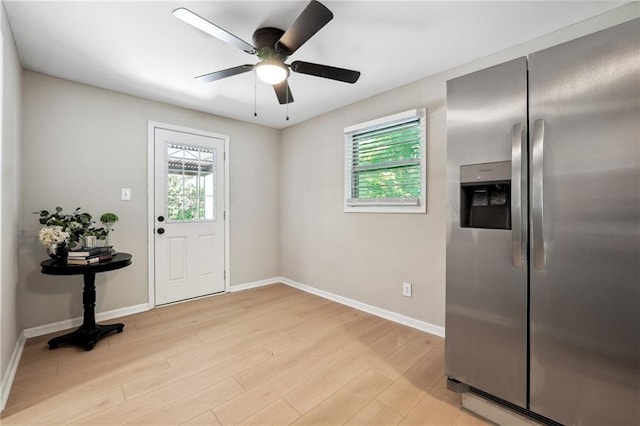 interior space with ceiling fan, plenty of natural light, and light wood-type flooring