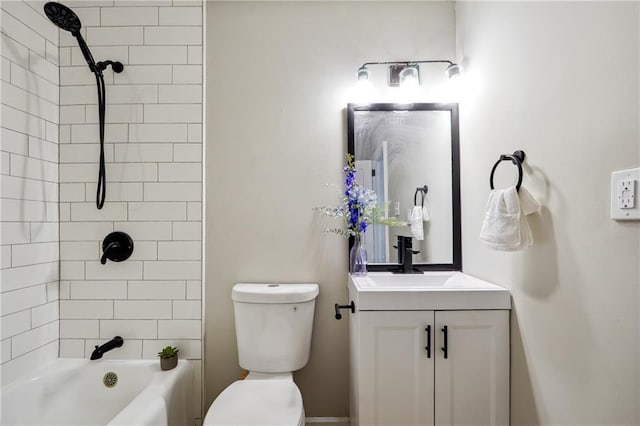 full bathroom with vanity, toilet, and tiled shower / bath