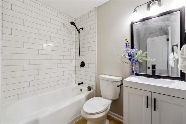 full bathroom with vanity, toilet, and tiled shower / bath