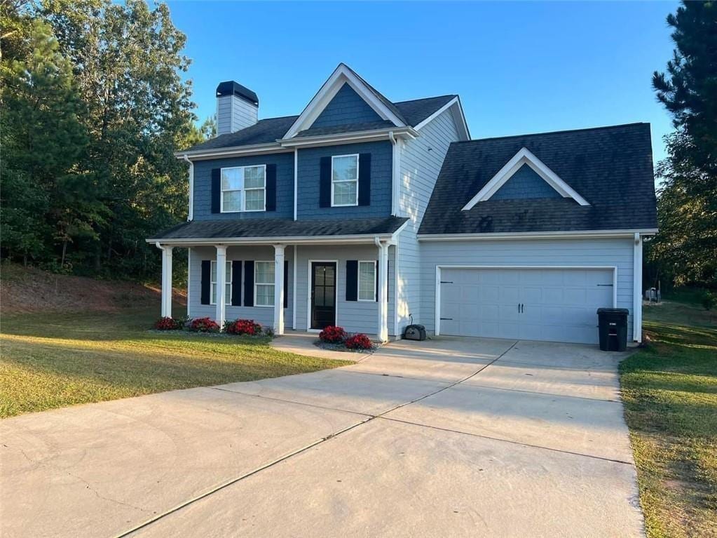 view of front of home with a front lawn and a porch