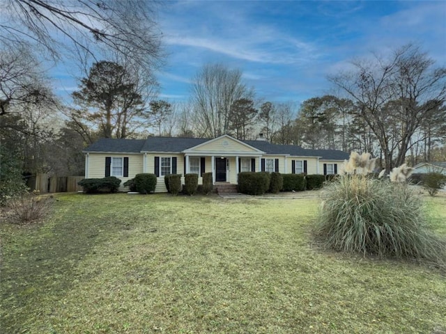 single story home featuring a front yard