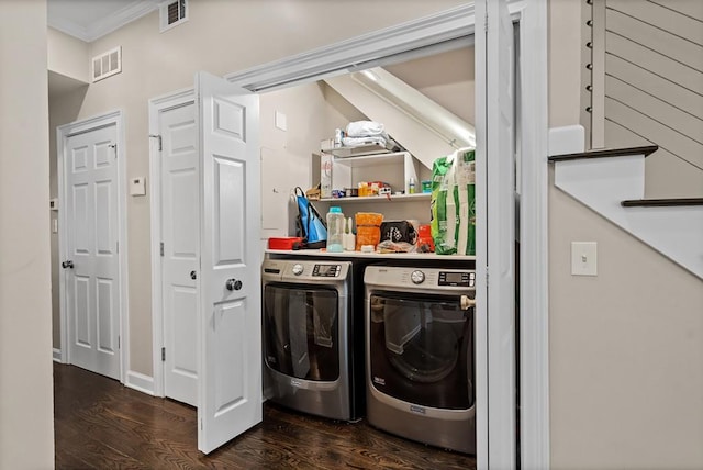 laundry area with independent washer and dryer, dark wood-type flooring, and ornamental molding