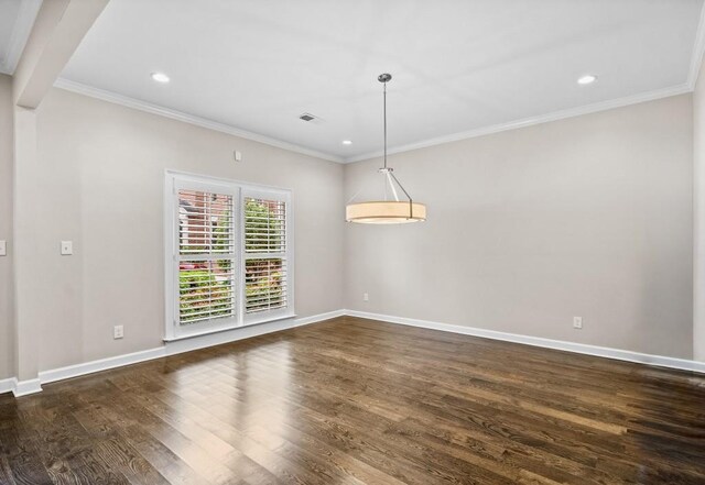 unfurnished room featuring ornamental molding, dark wood-type flooring, baseboards, and recessed lighting