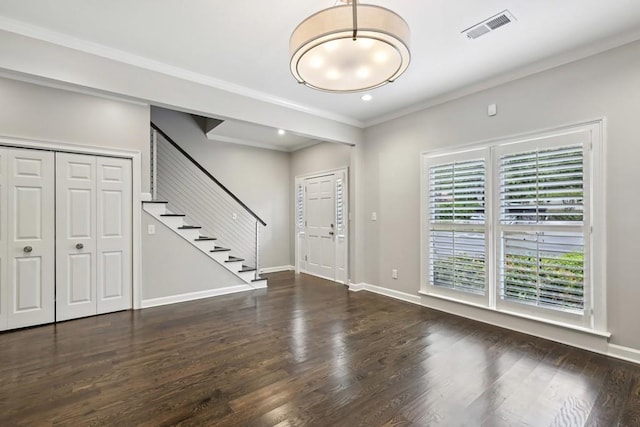 entryway with stairs, wood finished floors, baseboards, ornamental molding, and recessed lighting