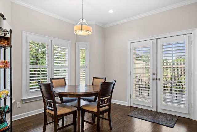 dining room featuring healthy amount of natural light, crown molding, baseboards, dark wood-style flooring, and french doors