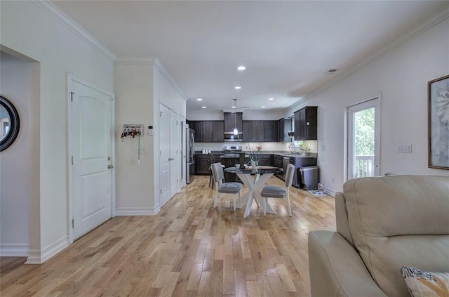 544 Pine Way, Dallas, GA 30157 - dining room with light wood finished floors, crown molding, baseboards, and recessed lighting