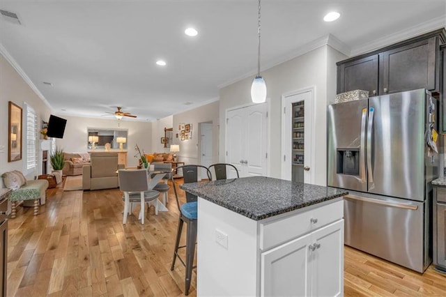 544 Pine Way, Dallas, GA 30157 - kitchen with stainless steel refrigerator with ice dispenser, ornamental molding, a breakfast bar area, light wood-type flooring, and ceiling fan
