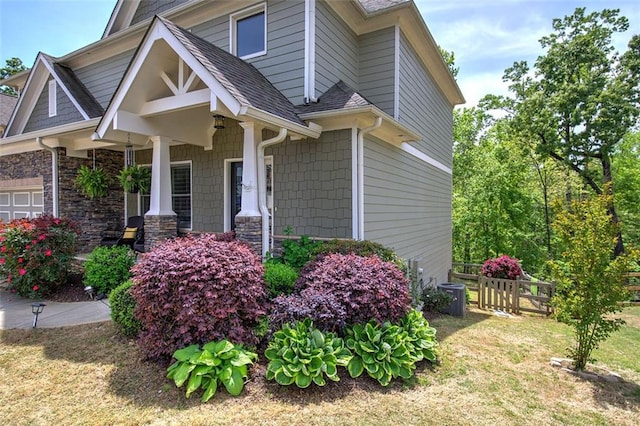 544 Pine Way, Dallas, GA 30157 - view of property exterior with an attached garage, roof with shingles, a porch, and stone siding