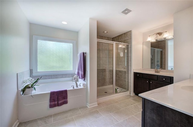 544 Pine Way, Dallas, GA 30157 - full bath with vanity, a shower stall, a garden tub, baseboards, and tile patterned floors