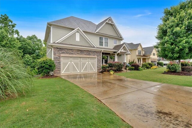 544 Pine Way, Dallas, GA 30157 - craftsman-style house featuring driveway, a front lawn, an attached garage, and stone siding