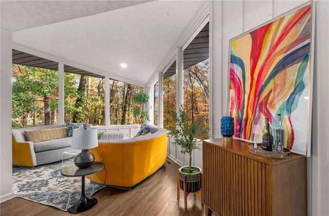 sunroom with lofted ceiling