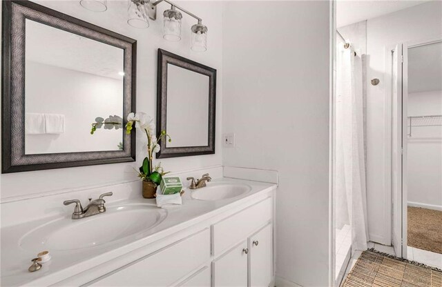 bathroom with vanity and curtained shower