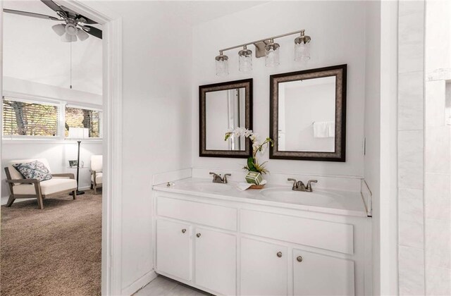 bathroom featuring ceiling fan and vanity