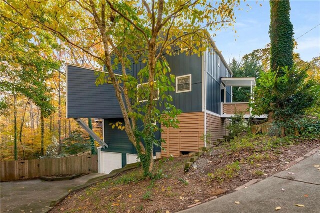 view of side of property featuring a garage