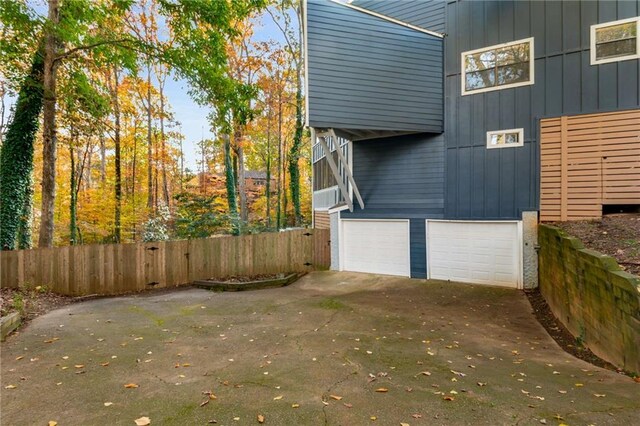 view of side of property featuring a garage