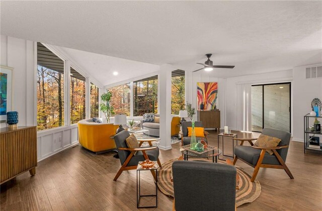 sunroom / solarium featuring a wealth of natural light and ceiling fan