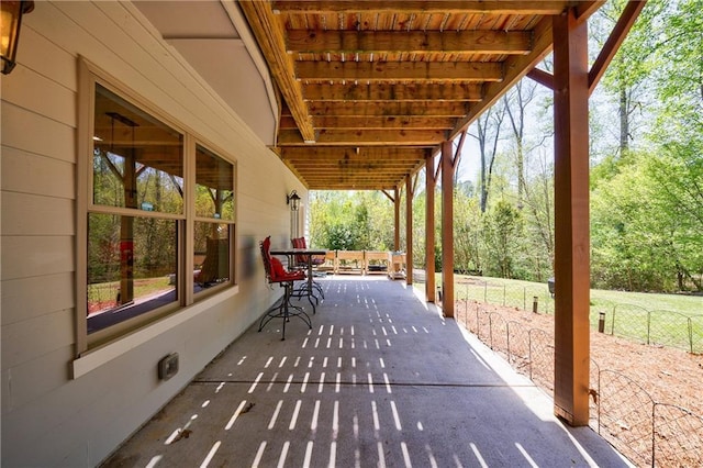 view of patio / terrace featuring fence