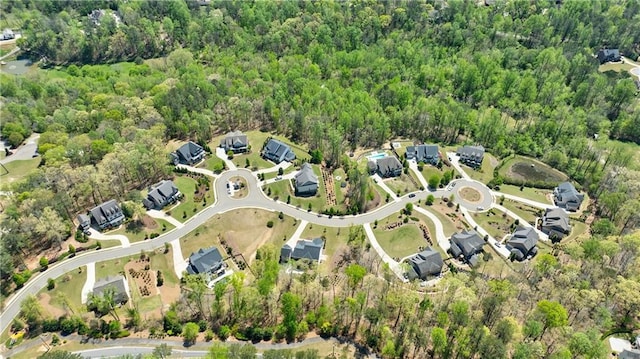 birds eye view of property with a wooded view