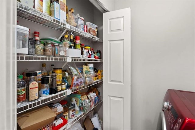 storage area with washer and clothes dryer