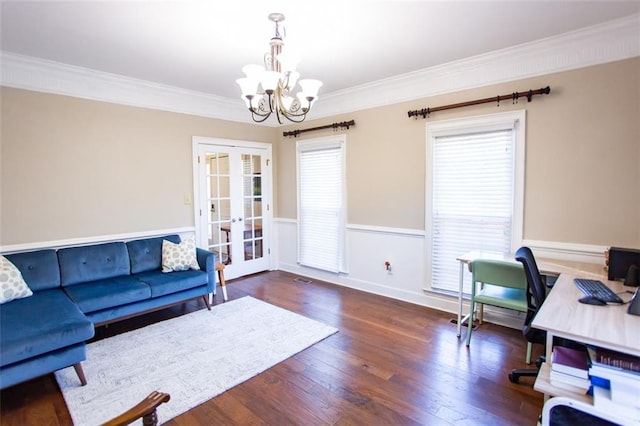 home office featuring ornamental molding, dark hardwood / wood-style floors, a notable chandelier, and french doors