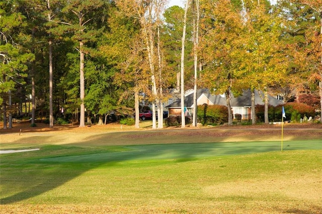 view of community with a lawn and a water view