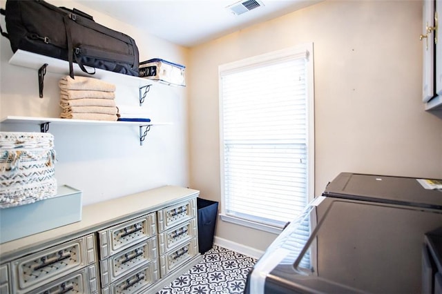 washroom with washing machine and clothes dryer