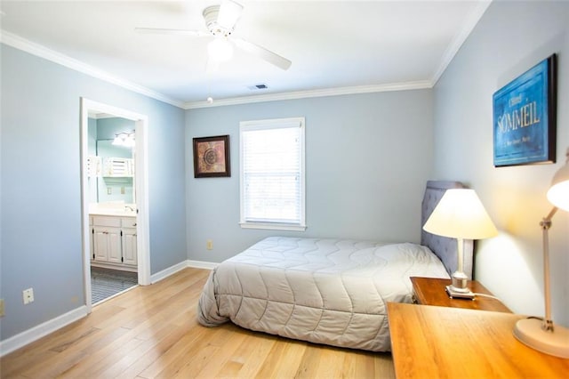 bedroom featuring ceiling fan, crown molding, light hardwood / wood-style flooring, and ensuite bath