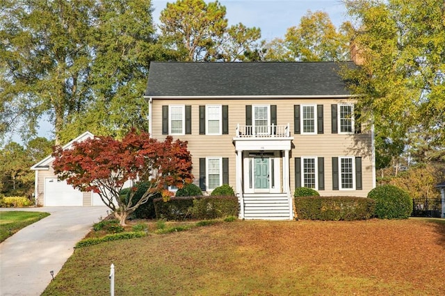 colonial inspired home featuring a balcony