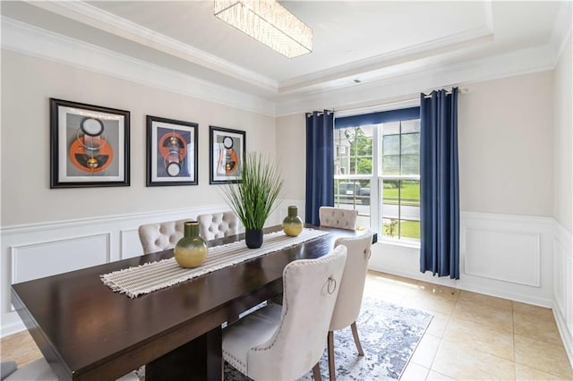 441 Spring View Dr, Woodstock, GA 30188 - dining space with a raised ceiling, crown molding, wainscoting, light tile patterned flooring, and a decorative wall