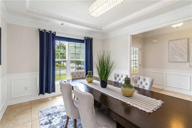 441 Spring View Dr, Woodstock, GA 30188 - dining area featuring plenty of natural light, a tray ceiling, a wainscoted wall, light tile patterned floors, and ornamental molding