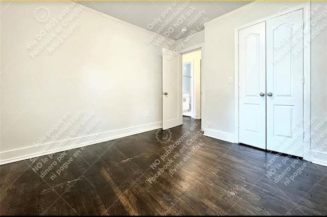1914 N Ave NW, Atlanta, GA 30318 - unfurnished bedroom featuring baseboards and dark wood finished floors