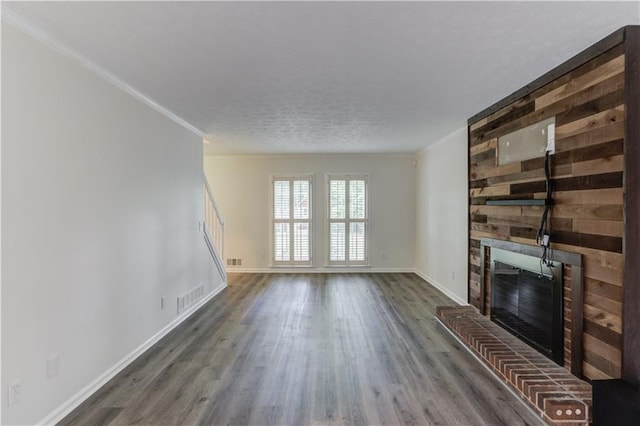 6006 Lanier Heights Cir, Buford, GA 30518 - unfurnished living room with a fireplace, wood finished floors, and baseboards