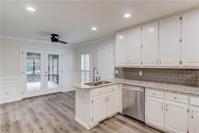 6006 Lanier Heights Cir, Buford, GA 30518 - kitchen with stainless steel dishwasher, a sink, a peninsula, french doors, and a ceiling fan