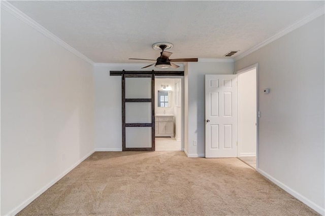 6006 Lanier Heights Cir, Buford, GA 30518 - unfurnished bedroom with carpet flooring, crown molding, a barn door, baseboards, and connected bathroom