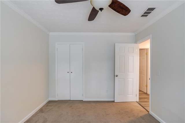 6006 Lanier Heights Cir, Buford, GA 30518 - unfurnished bedroom with ornamental molding, carpet flooring, baseboards, a closet, and a ceiling fan