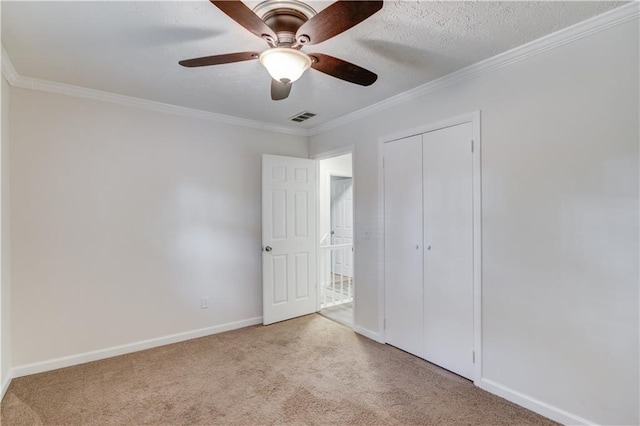 6006 Lanier Heights Cir, Buford, GA 30518 - unfurnished bedroom featuring carpet, ornamental molding, baseboards, a closet, and a ceiling fan