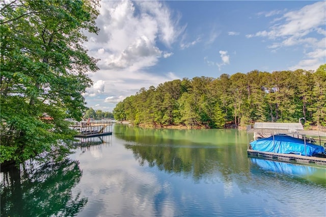 6006 Lanier Heights Cir, Buford, GA 30518 - water view featuring a floating dock and a heavily wooded area