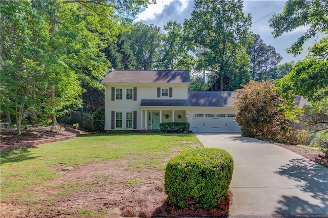 6006 Lanier Heights Cir, Buford, GA 30518 - colonial inspired home featuring concrete driveway, a garage, and a front lawn