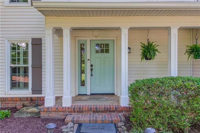 6006 Lanier Heights Cir, Buford, GA 30518 - doorway to property featuring a porch