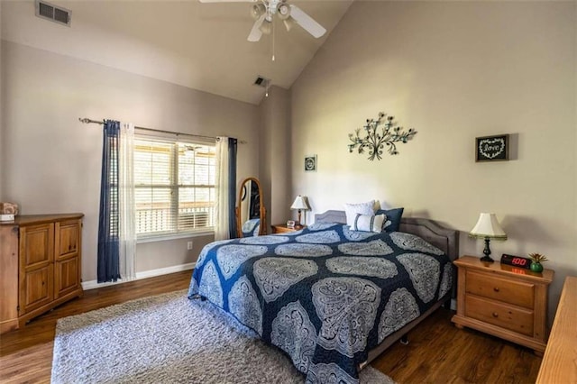 bedroom featuring ceiling fan, dark wood-type flooring, and high vaulted ceiling