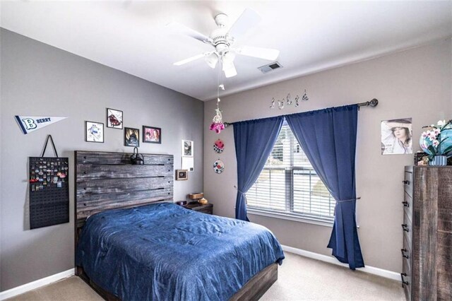 bedroom with ceiling fan and carpet floors