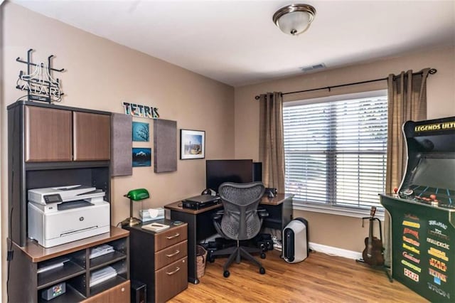 home office with light wood-type flooring