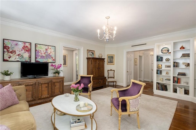 1325 Peachtree St NE Unit 401, Atlanta, GA 30309 - living area featuring built in shelves, wood finished floors, baseboards, a notable chandelier, and ornamental molding