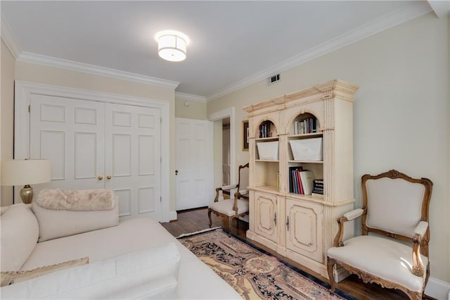 1325 Peachtree St NE Unit 401, Atlanta, GA 30309 - bedroom featuring visible vents, ornamental molding, wood finished floors, and a closet