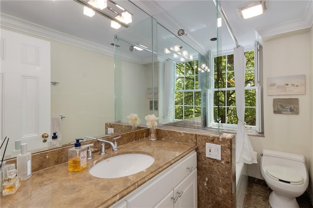 1325 Peachtree St NE Unit 401, Atlanta, GA 30309 - bathroom featuring toilet, walk in shower, ornamental molding, and vanity